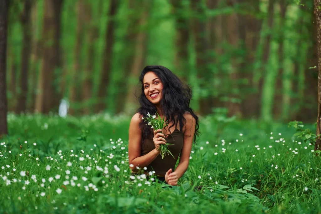 Positive Brunette un casual clothes enjoying the nature